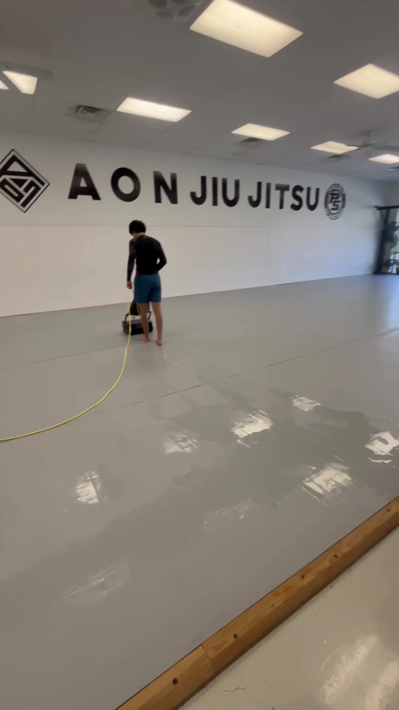 GNC Mat Cleaning working on the mat floor at Aon Jiu Jitsu