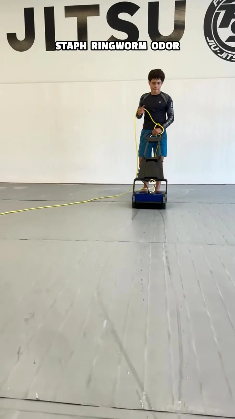 Commercial extractor moving across the Aon Jiu Jitsu mat floor